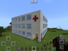 a large building with a red cross on the front and side windows in minecraft