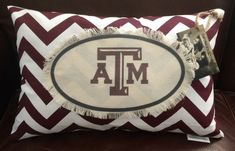 the texas a & m university pillow is sitting on a couch