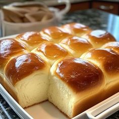 a white plate topped with bread on top of a counter