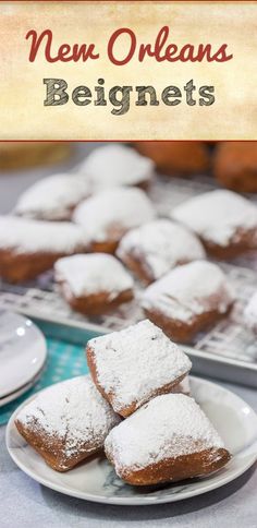 some powdered sugar covered pastries are on a white plate and there is a blue table cloth with the words new orleans beginner's