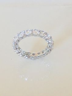 4 TCW 925 Sterling Silver Round Cut 4 mm CZ Prong Eternity Bridal Ring Band Size 4-11 by shopcelebritystyles on Etsy Lab Grown Diamond Eternity Band For Promise, Round Lab Grown Diamond Eternity Band Promise Ring, White Eternity Band With Vs Clarity, Lab Grown Diamond Eternity Band With Prong Setting, Dazzling Lab-grown Diamond Eternity Band, White Vs Clarity Round Eternity Band, Dazzling Eternity Band With Prong Setting, Round Halo Cubic Zirconia Wedding Ring, Halo Round Cubic Zirconia Wedding Ring