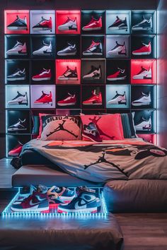 a bed with red, white and blue lights on the headboard in front of a wall of shoes