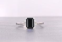 Black onyx is said to make the wearer more charming and attractive to others. Ties a strong bond: Black onyx is said to strengthen relationships and foster a deep connection between partners.  Gemstone: Premium Grade Black onyx Shape/Size: Octagon shaped 8x6MM Material: Solid 14K Gold/ 925 Sterling Silver also available Ring Size: Choose From Above Options Finish Type: Choose From Above Options Premium Black onyx bridal rings black onyx Wedding ring vintage art deco ring Statement Ring onyx jewe Classic Onyx Jewelry For Wedding, Onyx Gemstone Rings For Wedding, Elegant Round Onyx Rings, Onyx Round Wedding Ring, Elegant Black Emerald Cut Jewelry, Classic Black Jewelry For Wedding, Elegant Black Jewelry For Formal Occasions, Black Fine Jewelry Ring As A Gift, Fine Jewelry Black Rings As Gift