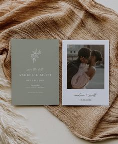 an open photo book with a couple's wedding photos on it next to a blanket