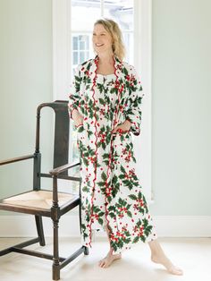 Meet your new favorite seasonal relaxation staple! This classic Holiday robe — designed to make you feel comfortable, and look even better — is made from 100% soft, mid-weight cotton and hand-block printed by artisans. Unlike bulky robes, this one is made to flatter your figure with scalloped edges, creating a feminine silhouette for every type of body. It’s the Goldilocks of comfort… not too tight, not too loose, just right for lounging after a shower, drinking your morning coffee, or snuggling Deep Winter Capsule Wardrobe, Mistletoe Print, Designer Loungewear, Holly Print, Pinterest Trends, Scallop Design, Winter Capsule, Build A Wardrobe, Winter Capsule Wardrobe