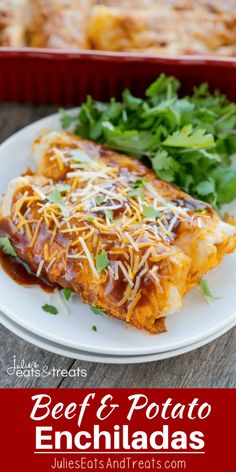 an enchilada on a white plate next to a red casserole dish