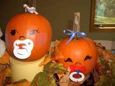 two pumpkins with faces painted on them