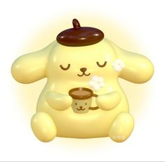 a yellow teddy bear holding a cup of coffee