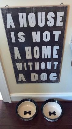 there is a sign on the wall that says it is not a home without a dog