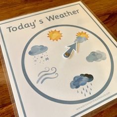 a weather clock is shown on the table