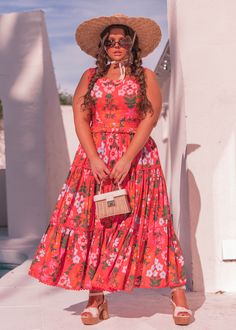 Bright & Breezy Step into the vibrant essence of the tropics with our stunning coral dress adorned with a delightful array of tropical blooms and lush leaves. This enchanting piece captures the spirit of a tropical paradise, offering a fusion of elegance and exotic charm. Features a scalloped edge square neckline and a tiered ruffle skirt. Perfect for any summer soiree, its flowing silhouette and intricate print evoke the allure of a sun-kissed island getaway, ensuring you stand out with effortless grace and style. Scalloped square neckline Back zipper Fitted waistline Pockets Recommend sizing up, if between sizes Model Details Content + Care 100% Cotton Machine Wash Cold Hang Dry Try-On Video Nani Dress Try-On Video XS & XXL Coral Summer Vacation Dresses, Coral Summer Beach Dress, Coral Beach Dress For Summer, Orange Tropical Maxi Dress For Spring, Orange Tropical Print Maxi Dress For Spring, Spring Tropical Orange Maxi Dress, Tropical Orange Floral Print Maxi Dress, Spring Orange Maxi Dress With Tropical Print, Tropical Maxi Dress For Garden Party