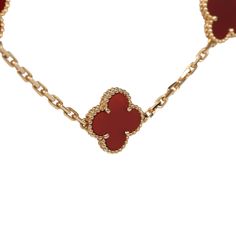 This Van Cleef & Arpels Vintage Alhambra 20 Motif necklace is in 18K yellow gold with 20 carnelian clover motifs. It has a hallmark lobster clasp closure without the metal markings that the newer ones have as it is an older model.Origin: FranceCondition: Never wornAccompanied by: VCA green jewelry box, box and authenticity card Measurements: Necklace length 33"; Motif: .5' x .5" Luxury Red 14k Gold Necklace, Luxury 14k Gold Red Necklace, Luxury Gold Carnelian Jewelry, Luxury Carnelian Jewelry For Formal Occasions, Classic Yellow Gold Carnelian Jewelry, Classic Carnelian Yellow Gold Jewelry, Elegant Gold Carnelian Jewelry, Elegant Carnelian Necklace With Polished Finish, Yellow Gold Carnelian Jewelry With Polished Finish