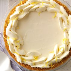 a cake with white frosting and yellow sprinkles