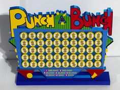 a game that is sitting on top of a table next to a sign with the word punch a bunch printed on it