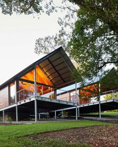 the house is made out of metal and has two levels on each level that are connected to one another