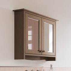 a wooden cabinet above a sink in a bathroom