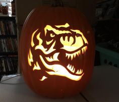 a carved pumpkin with an image of a dragon on it