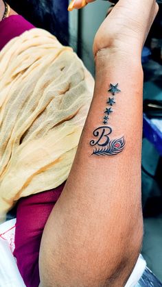 a person with a small tattoo on their arm