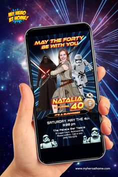 a person holding up a cell phone with the star wars app on it's screen