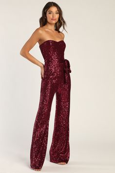 Catch some admiring glances when you hit the dancefloor in the Lulus Flirty Moves Wine Red Sequin Strapless Wide-Leg Jumpsuit! Dazzling wine red sequins dance across stretchy mesh as it shapes this party-ready jumpsuit that has a sweetheart neckline and a strapless, princess-seamed bodice (with hidden no-slip strips). A high waist, with a tying sash belt, tops wide-cut pant legs that fall to ankle-grazing hems. Hidden back zipper/clasp. Fit: This garment fits true to size. Length: Floor length. Red Sequin Jumpsuit, Party Outfit Formal, Jumpsuit Sequin, Burgundy Jumpsuit, Evening Jumpsuit, Sequin Jumpsuit, Lulu Fashion, Strapless Jumpsuit, Red Sequin