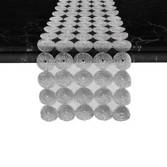 a black table topped with lots of white plates