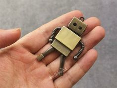 ★ Size: 36 x 63 mm (Maybe 1-2mm differs due to manual measurement)★ Material: Alloy★ Color: Bronze--------- Find similar items---------★ More Robot items, https://www.etsy.com/shop/hehepanda?search_query=robot★ More large pendants, https://www.etsy.com/shop/hehepanda?section_id=26322347--------- Better choice ---------★ Buy more, save more.★ Add my shop to favorites, see updates quickly. Robot Keychain, Robot Sculpture, Wholesale Necklaces, Arrow Pendant, Keychain Charm, Diy Pottery, Owl Pendant, Robot Art, Charm Keychain