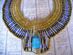 Handmade in Egypt by local craftsman. This outstanding and stunning necklace is handmade in true ancient Egyptian tradition with seed beads and genuine handmade exrea large Egyptian scarab bead.    The perfect piece of jewelry for an Egyptian fancy dress costume. $75.00 Egyptian Fancy Dress, Egyptian Collar, Egypt Jewelry, 1001 Nights, Egyptian Necklace, Insect Jewelry