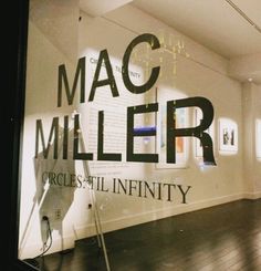 an image of the inside of a building that is advertising mac miller's exhibition