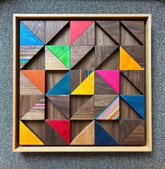 an art piece made out of wood with different colors