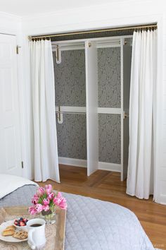 an image of a bedroom with white curtains