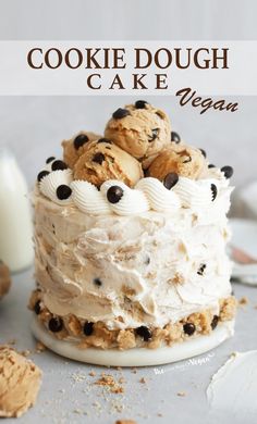 a close up of a cake on a plate with cookie dough and chocolate chip cookies