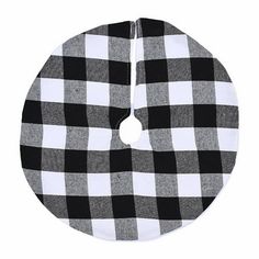 a black and white checkered cloth with a circle on the bottom that has a hole in it