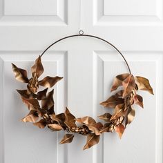 a metal wreath hanging on the front door