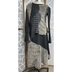 This Aimee G Two-Piece Outfit Is A Must-Have For Any Fashion-Conscious Woman. The Asymmetrical Textured Patchwork Design Adds A Touch Of Edginess To The Elegantly Styled Set. The Long-Sleeved Sweater And Skirt Are Made Of A Stretchy Cotton Blend That Will Keep You Comfortable All Day Long. The Gray Color Of The Set Is Accentuated By The Multi-Type Of Fabric Used In The Accents, Making It Perfect For Any Occasion. The Outfit Is Perfect For Women Who Want To Make A Statement While Remaining Comfor Fitted Asymmetrical Skirt For Layering, Fall Patchwork Asymmetrical Skirt, Winter Fitted Skirt With Asymmetrical Hem, Sweater Midi Skirt, Skirt Set Outfit, Sweater And Skirt, Midi Skirt Set, Sweater Skirt Set, Sleeved Sweater