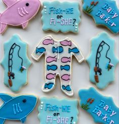 decorated cookies with different types of fish and sea animals on them, including one for the baby to be