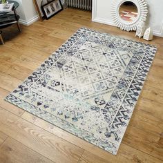 a blue and white area rug in a living room