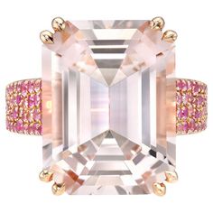 Desirable 10.66 carat Morganite Emerald-Cut, 18K rose gold ring, decorated with a variety of 1.25 carat Pink Sapphires, and 0.42 carat round brilliant diamonds. Ring size 6.5. Resizing is complementary upon request. Returns are accepted and paid by us within 7 days of delivery. Please FOLLOW the MERKABA storefront to be the first to view the latest of our ultra exclusive jewels and supreme gemstones. Merkaba Jewelry, is a unique, world-class jewelry brand, dedicated to unveiling the rarest, finest and most sought-after gemstones globally, such as Alexandrite, Paraiba Tourmaline, "no oil" Emeralds, unheated Sapphires and Rubies, Padparadscha Sapphire, Aquamarine, Tsavorite, Spinel, Mandarin Garnet, Chrome Tourmaline, Cat's Eye Chrysoberyl, Star Ruby and Star Sapphire, Demantoid Garnet, Tanz Class Jewelry, Mandarin Garnet, Morganite Necklace, Chrome Tourmaline, Rose Gold Ring Set, Green Tourmaline Ring, Demantoid Garnet, Padparadscha Sapphire, Tanzanite Ring