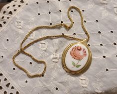 "Absolutely Gorgeous Vintage signed Whiting and Davis Co Pendant with Mirror on the back.  This beauty has a wonderful painted pink flower set against a white background surrounded by a golden rim. The back has the Whiting and Davis Co signature and a Mirror used to check or apply your lipstick (none on your teeth!) This is an absolute vintage beauty! This comes with a charming chain, lobster claw closure and 8 1/2\" drop. The chain has the marker \"925 Italy\" . This jewelry hallmarks simply indicate that a piece was made in Italy. Technically, though, it still consists of a sterling silver base with gold on top of it. The history Whiting and Davis vintage costume jewelry began in the distant 1876, when three men met in Boston. Willian H.Wade, Edward P. Davis and Louis Heckman organized a Necklace Lipstick, Lipstick Mirror, Italy Necklace, Floral Pendant, Statement Bracelet, Vintage Beauty, Vintage Costume Jewelry, Vintage Costumes, Victorian Era