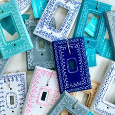 many different colored and patterned light switch plates