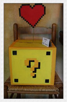 a yellow chest with a red heart on top