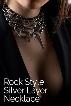 Rock style layer link necklace for women - silver massive chocker charms necklace. A Rocker style necklace inspired by singer Billy Eilish that I love so much. The necklace is made of seven layers and is decorated with charms, crosses, angle, key, and spikes. So if you like jewelry with a presence, and a rocker punk style jewelry then this necklace is yours. Rock Punk chunky layered pendants silver necklace for women and girls #punk #rockstyle #layerednecklace #BezalelDesign Silver Rock Style Jewelry For Party, Edgy Silver Jewelry With Charms, Silver Punk Jewelry With Double Chain, Silver Chain Necklace For Concert, Silver Necklace For Concert, Silver Rock Style Jewelry, Silver Rock Style Jewelry For Concerts, Silver Rock Jewelry For Concerts, Trendy Silver Jewelry For Concerts