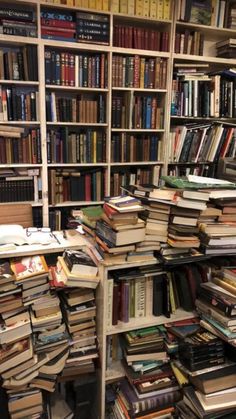 a room filled with lots of books on shelves