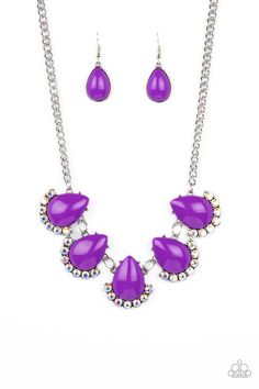 Underscored by rows of iridescent rhinestones, a row of oversized purple teardrop beads dramatically links into a powerful pop of color below the collar. Features an adjustable clasp closure. Due to its prismatic palette, color may vary. Sold as one individual necklace. Includes one pair of matching earrings. Purple Crystal Necklaces With Jewels, Purple Multi-strand Necklace For Party, Playful Adjustable Purple Necklace, Elegant Faceted Purple Crystal Necklace, Elegant Purple Multi-stone Necklace, Latest Jewellery Trends, Orange Necklace, Purple Beads, Yellow Necklace