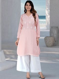 The very beautiful hand embroidered Linen-cotton tunic or kurta, available on demand (made to order) and customizable.Sizing: Please refer to our Size Chart to find your sizeThe item features55% Linen 45% CottonV Neck with front button placket.Beautiful Embroidery on top front and sides and hemLong tunic for culottes, leggings or pantsFull Shirt sleeves with cuffAverage length for Long kurta: 45 inAverage length for Short kurta: 33 inLength of product may slightly vary as per the sizes. Please n Linen Kurta With Resham Embroidery, Linen Straight Kurta With Resham Embroidery, Straight Linen Kurta With Resham Embroidery, Festive Straight Kurta With Embroidered Hem, Summer Straight Kurta With Embroidered Hem, Long Sleeve Linen Kurta With Chikankari Embroidery, Spring Straight Kurta With Tonal Embroidery, Cotton Kurta With Embroidered Hem For Eid, Eid Cotton Kurta With Embroidered Hem