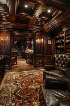 a room that has a couch, chair and rug on it in front of a bookcase