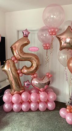 pink and gold balloons in the shape of numbers