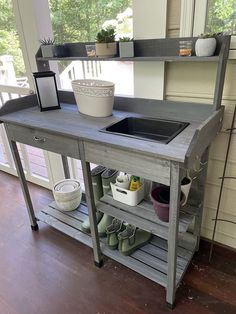 a kitchen island made out of an old wooden pallet with two sinks on it