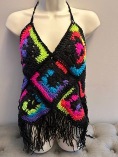 a crocheted halter top on a mannequin head