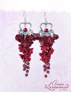 "Burgundy statement earrings Burgundy wedding earrings Dark red earrings Burgundy long earrings Chandelier earrings Marsala flower earrings ------------------------------------------------------------------------------ ♥ Very beautiful and feminine earrings. These earrings look very solemn.  ♥ These flowers earrings will fill in your look with romance and femininity. ♥Perfectly adorns a range of wedding dresses ♥ Can be a wonderful gift for a wife, sister or girlfriend Each little flower was carefully sculpted by me. Flower Earrings is made by hand in a special technique. For these flowers I used high quality polymer clay. Length of the earrings with hooks approx 9.5 см / 3.74\" ✿ These earrings can be made to order. Please allow 3-6 days for production time. ✿ Real colors may slightly dif Elegant Red Flower Earrings For Party, Red Dangle Flower Earrings For Valentine's Day, Red Elegant Drop Flower Earrings, Elegant Handmade Red Flower Earrings, Elegant Red Handmade Flower Earrings, Handmade Red Flower Earrings For Party, Elegant Red Drop Flower Earrings, Red Flower Drop Earrings For Wedding, Red Elegant Flower Earrings For Valentine's Day