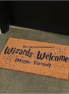 a welcome mat that says wizard's welcome hangs tailored in front of the door